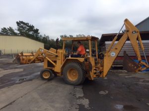 Street Supervisor Operating Backhoe