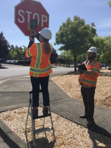 GHD staff conducting an assessment of road signs.