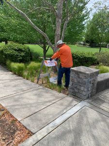 Public Works Employee Tom Arrington Puts up New Signage at Engler Park.