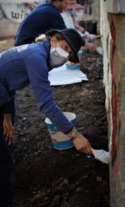 Nancy Evers Kirwan helps with graffiti abatement in Mountain Cemetery