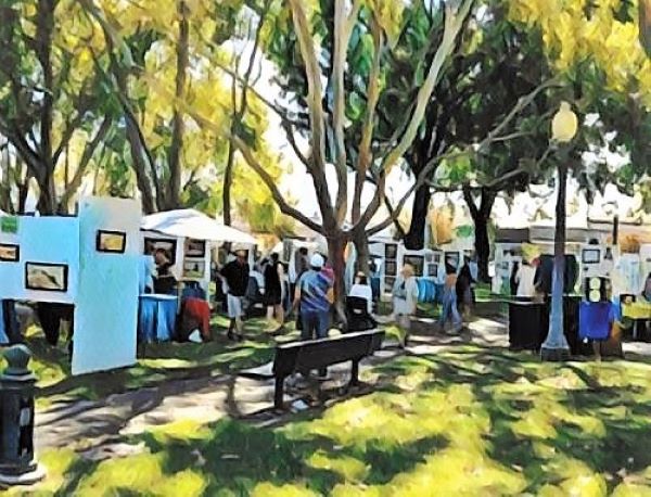 Image of outdoor art show in a park.