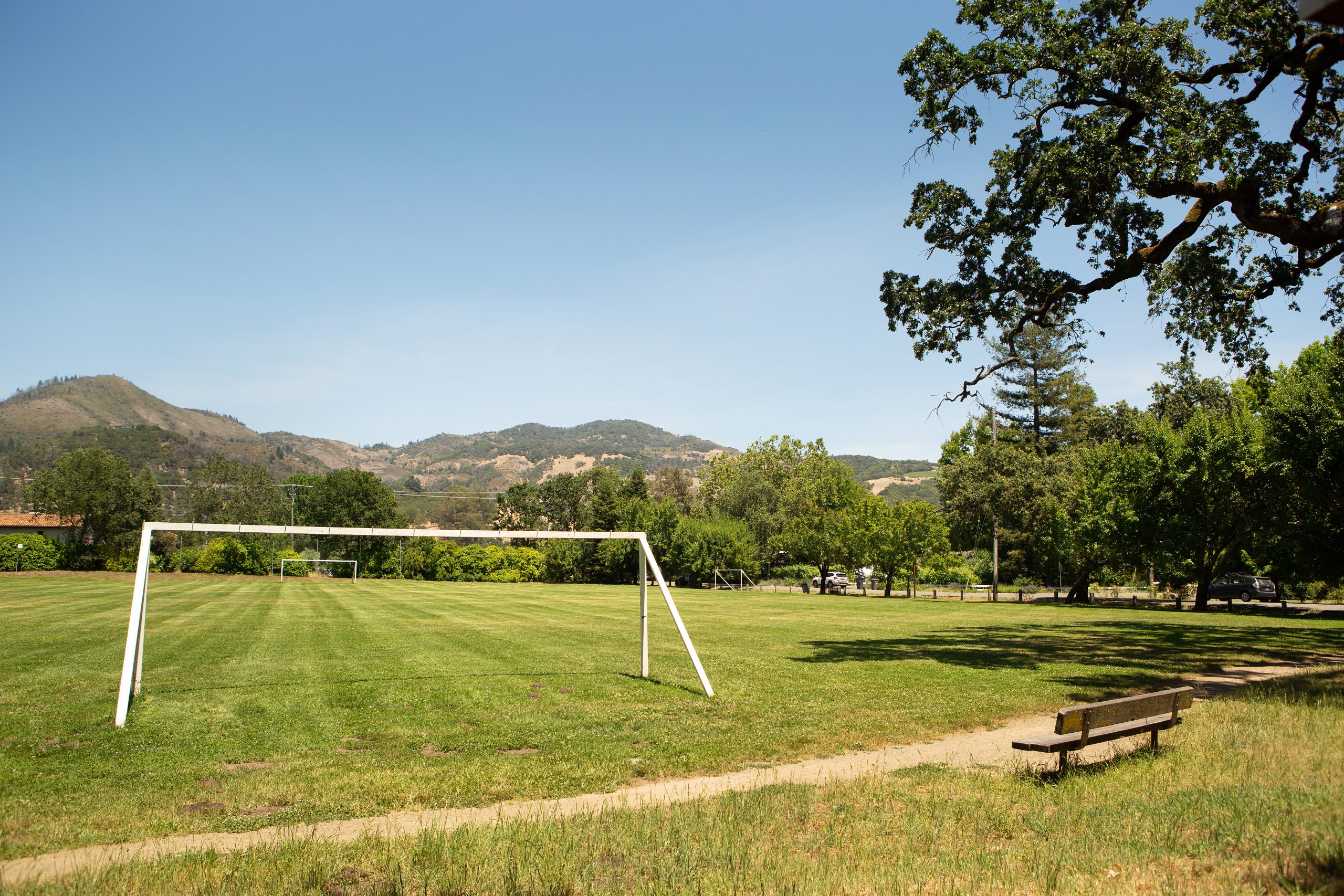 View of soccer field with mountains in background