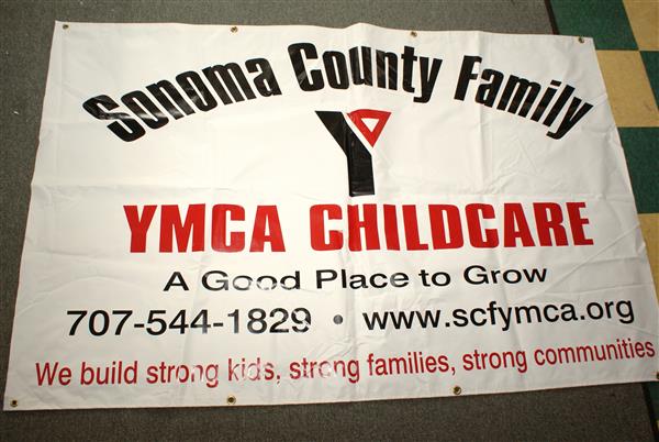 Banner with YMCA contact information.