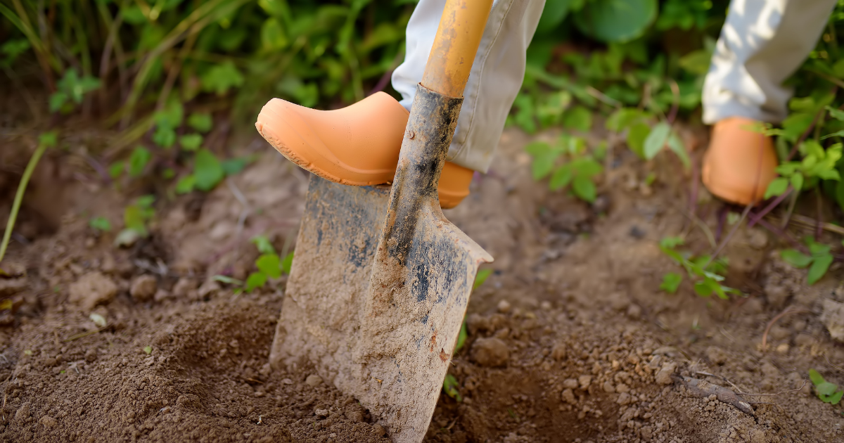 Person digging hole - April is Safe Digging Month