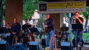 Band playing in an outdoor ampitheater.