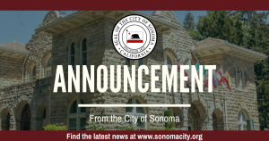 Photo of stone building with the word "Announcement" and the seal of the city.
