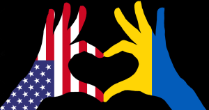 Illustration of two hands with the index fingers and thumbs touching to form the shape of a heart. The hand on the right is colored like the flag of the United States of America and the left hand is colored like the Ukrainian Flag.