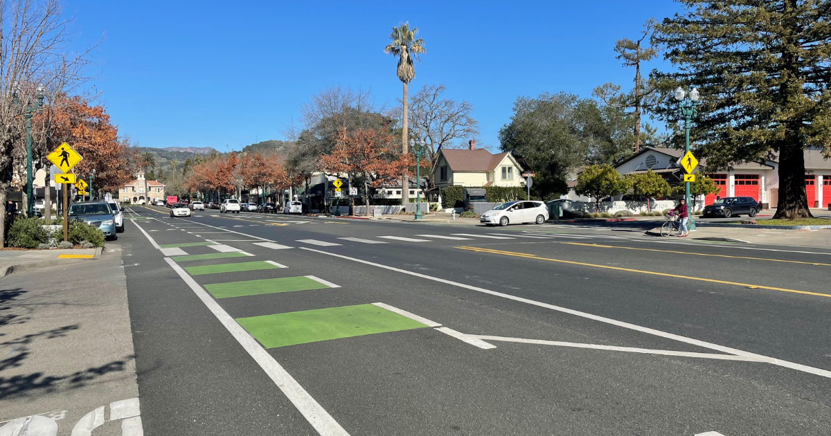 A road with a bike lane and crosswalk.