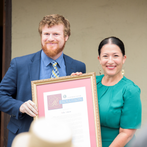 Ezrah Chaaban, Chief of Staff for CA Senator Bill Dodd, presenting a proclamation to the Poet Laureate.