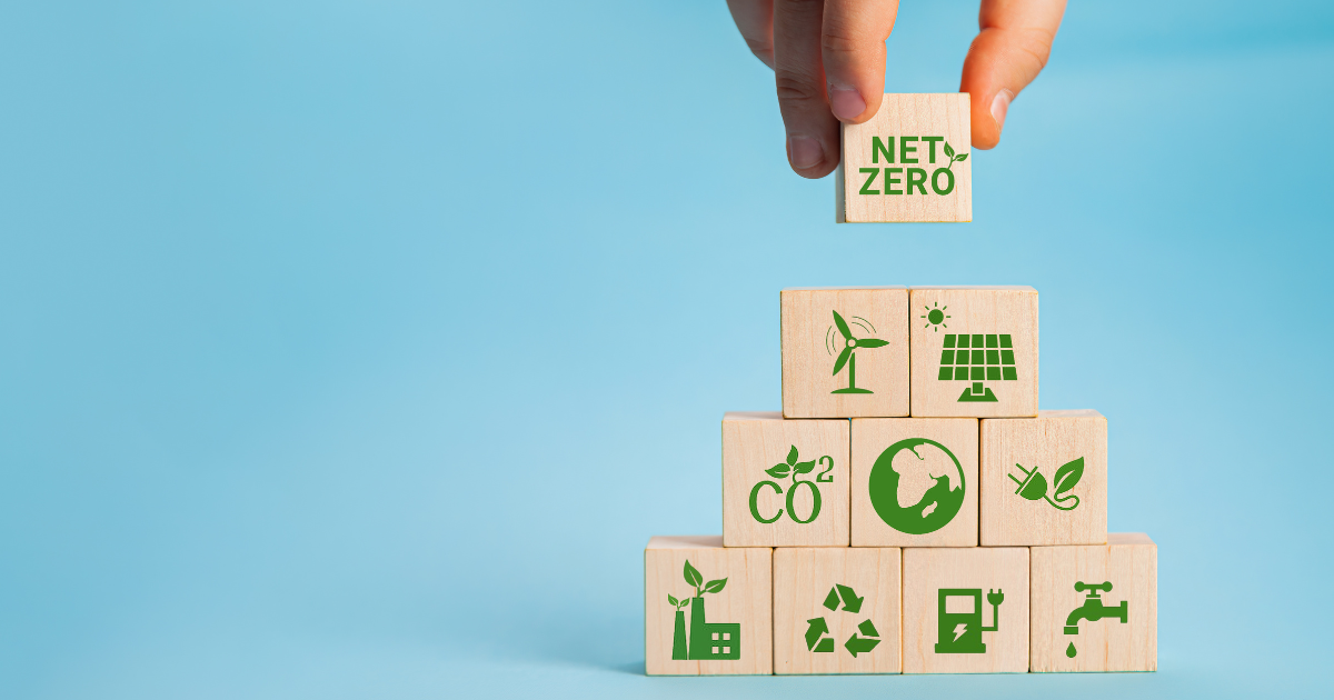 A stack of building block with symbols representing climate actions that can reduce green house gas emissions.