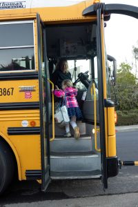 Girl Boarding Bus