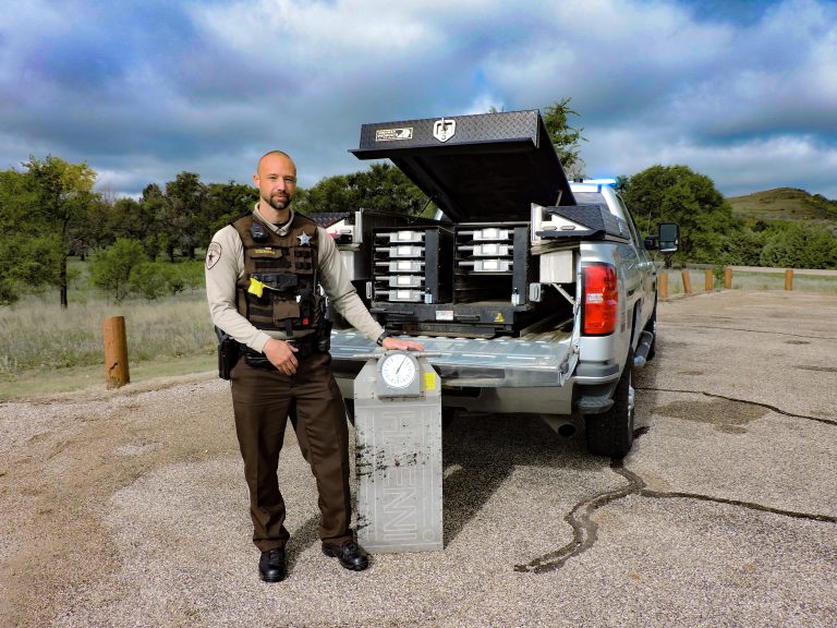 Male Weight Enforcement Deputy showing vehicle scales