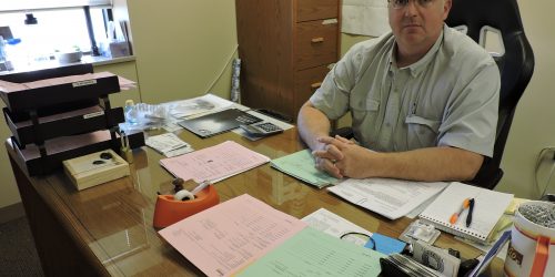 Male civil service sergeant at desk