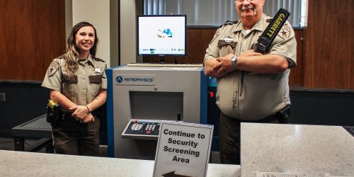 Female and male Courthouse Security Deputies in the security screening area