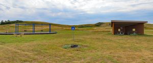 View of playground, campfire ring, and picnic pavilion