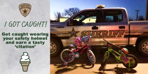 Sheriff's badge and ice cream cone pictured with a Sheriff's pickup truck and children's bicycles and helmets