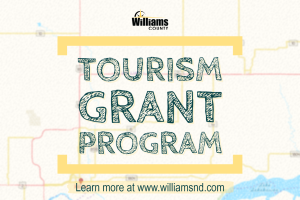 Image of a blurry map with the words Tourism Grant Program learn more at www.williamsnd.com