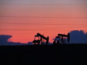 View of two pumpjacks at sunrise