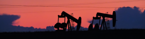 View of two pumpjacks at sunrise