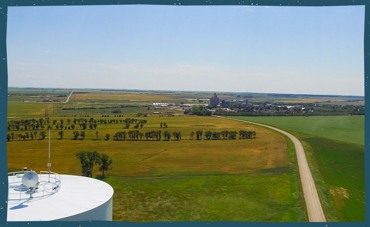 Aerial view of farmland and the city of Ray