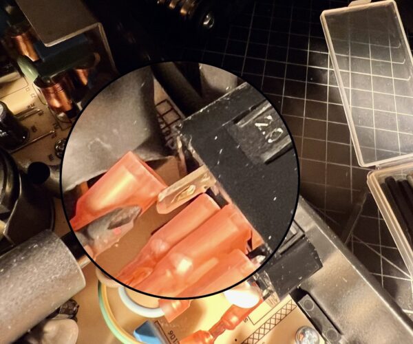Interior of a Prusa PSU showing a disconnected spade connector.