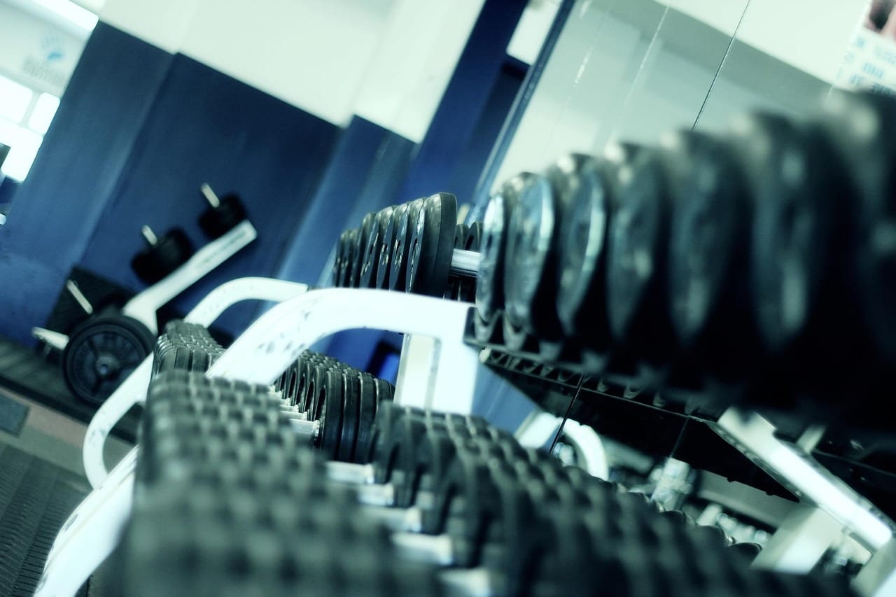 Barbell loaded with weight plates in a strength training gym
