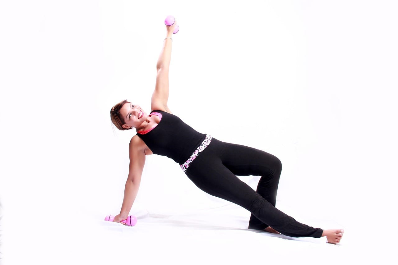 A set of neoprene and cast iron dumbbells on a gym floor