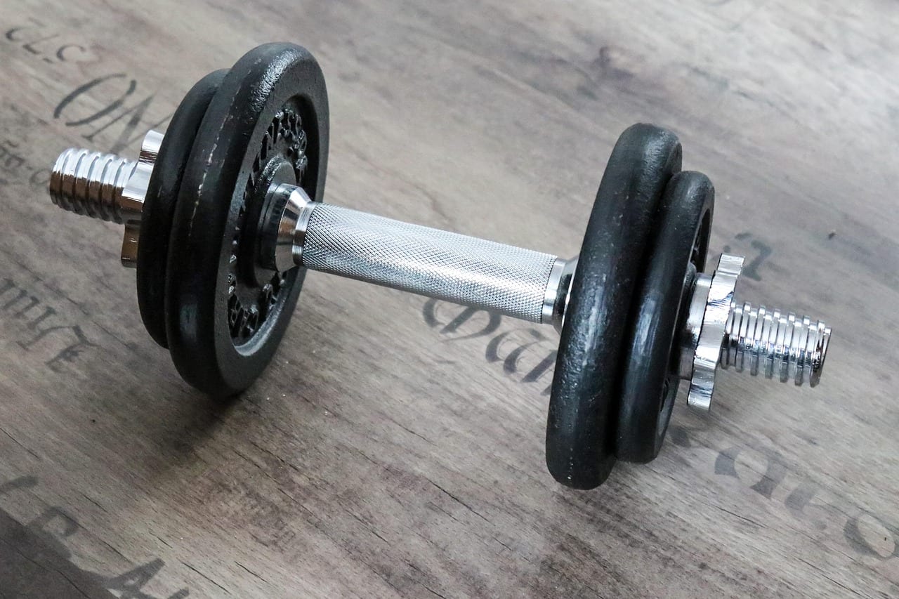 Athlete performing unilateral split squats with dumbbells