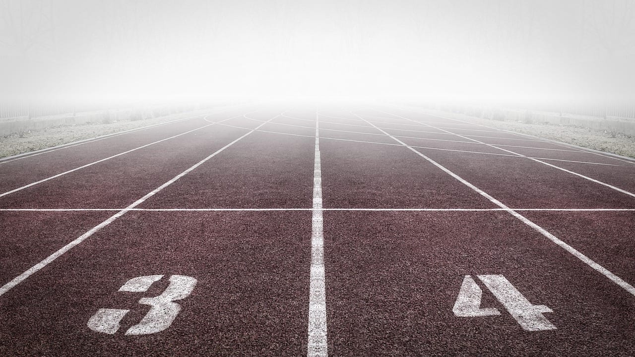 An athlete holding a kettlebell in the front rack position
