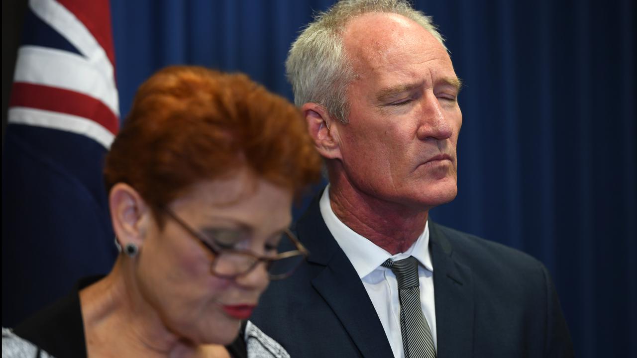 Mr Dickson at a press conference with his former party leadeE