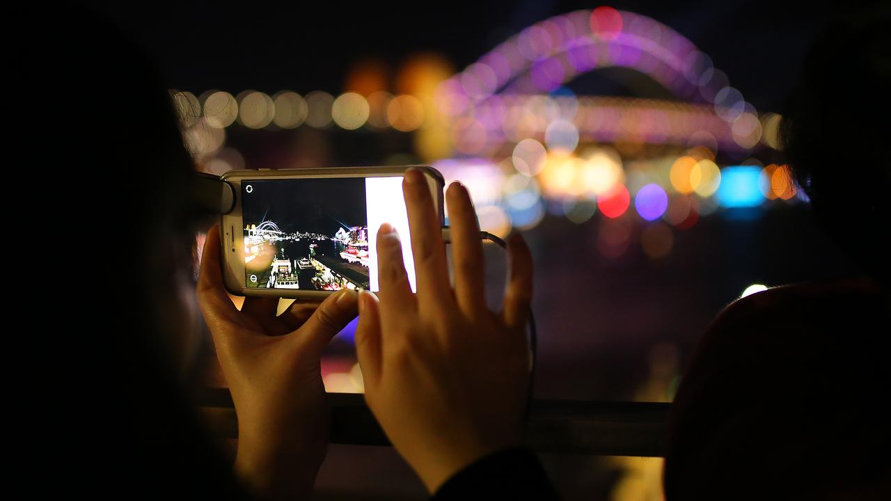 A photo being taken of the Sydney Harbour Bridge at night (file image)