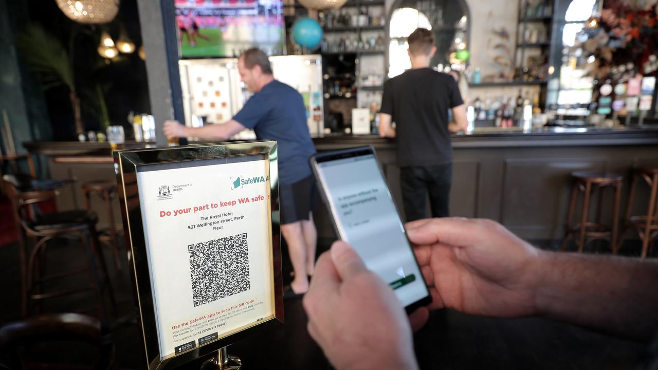 Someone scanning into a Perth pub in May 2022 (file image)