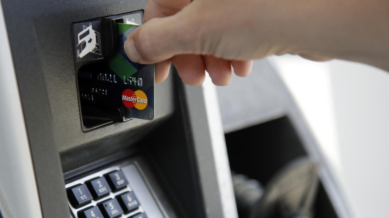 A customer inserts a credit card