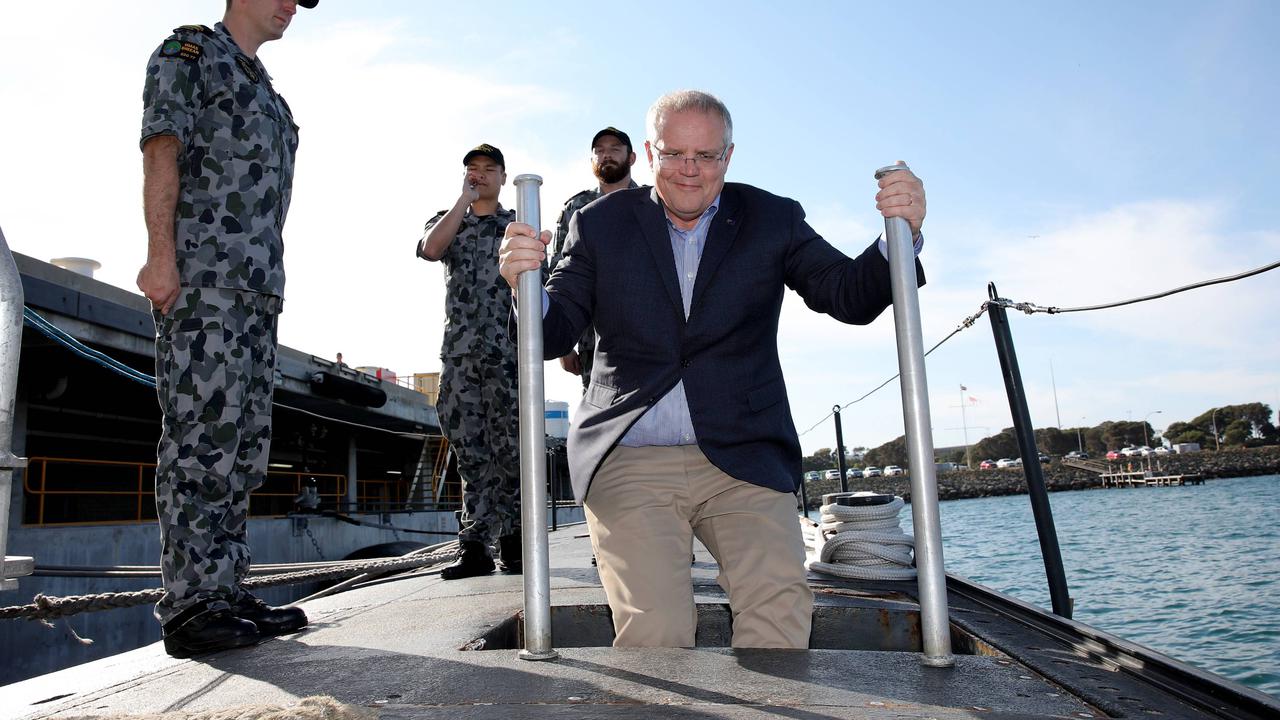 Former prime minister Scott Morrison boarding HMAS Sheean in 2019.