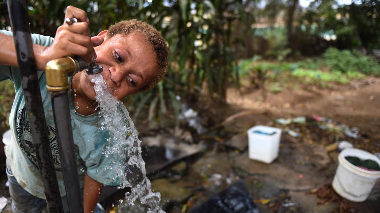 A child drinks water from a tap in Papua New Guinea (file image)