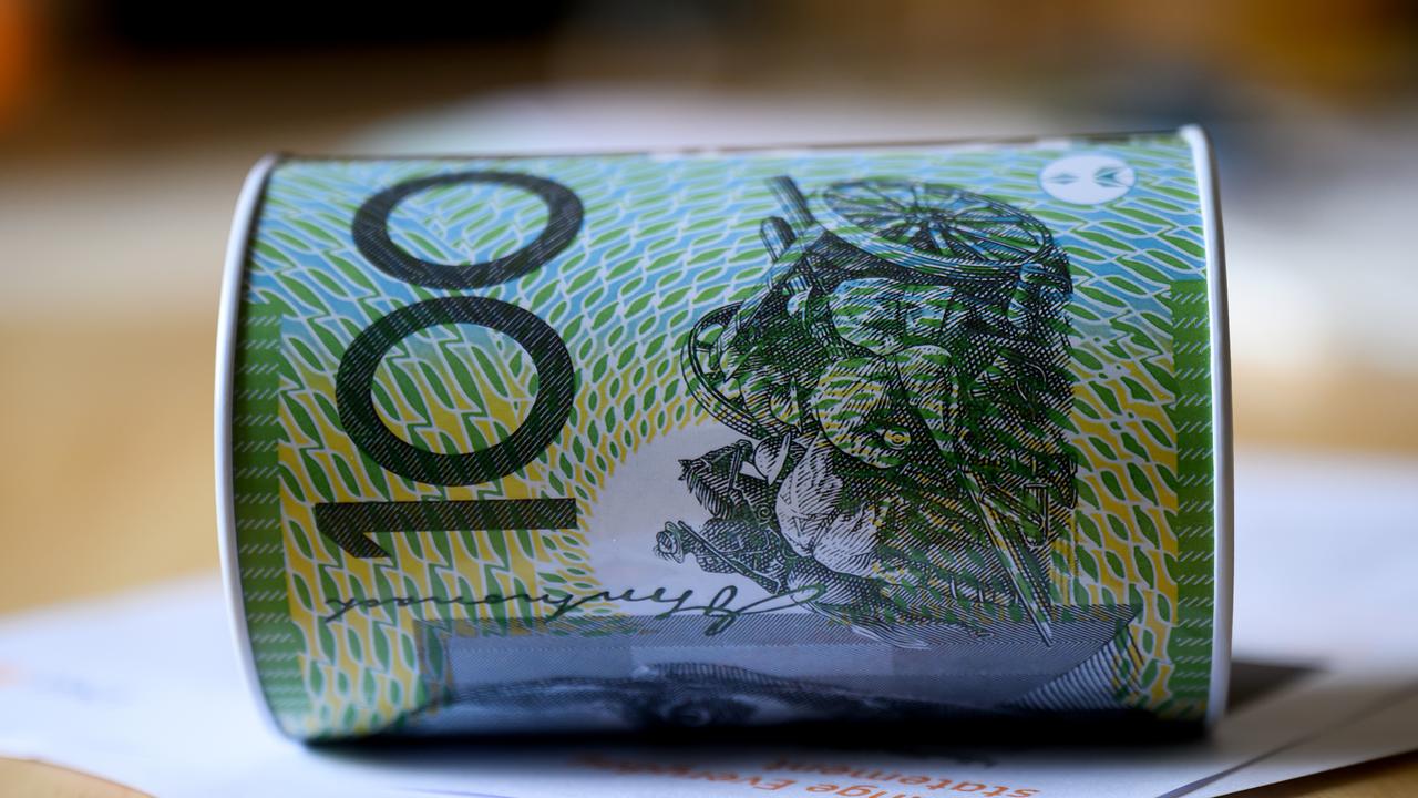 Money box with an Australian $100 note printed on it 2024.