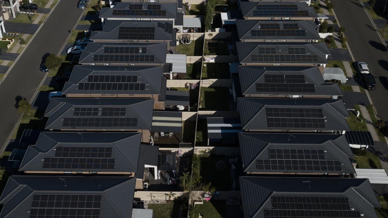 Houses with rooftop solar panels.