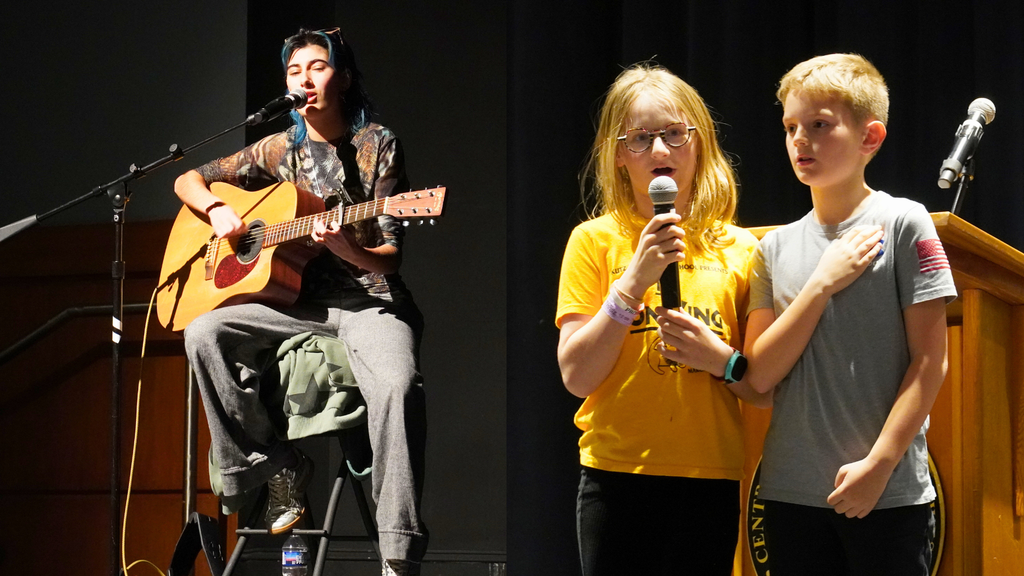 Students perform on stage