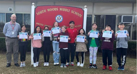 South Woods 6th graders pose with their certificates