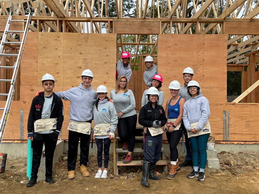 Rowing Club members pose on the job site