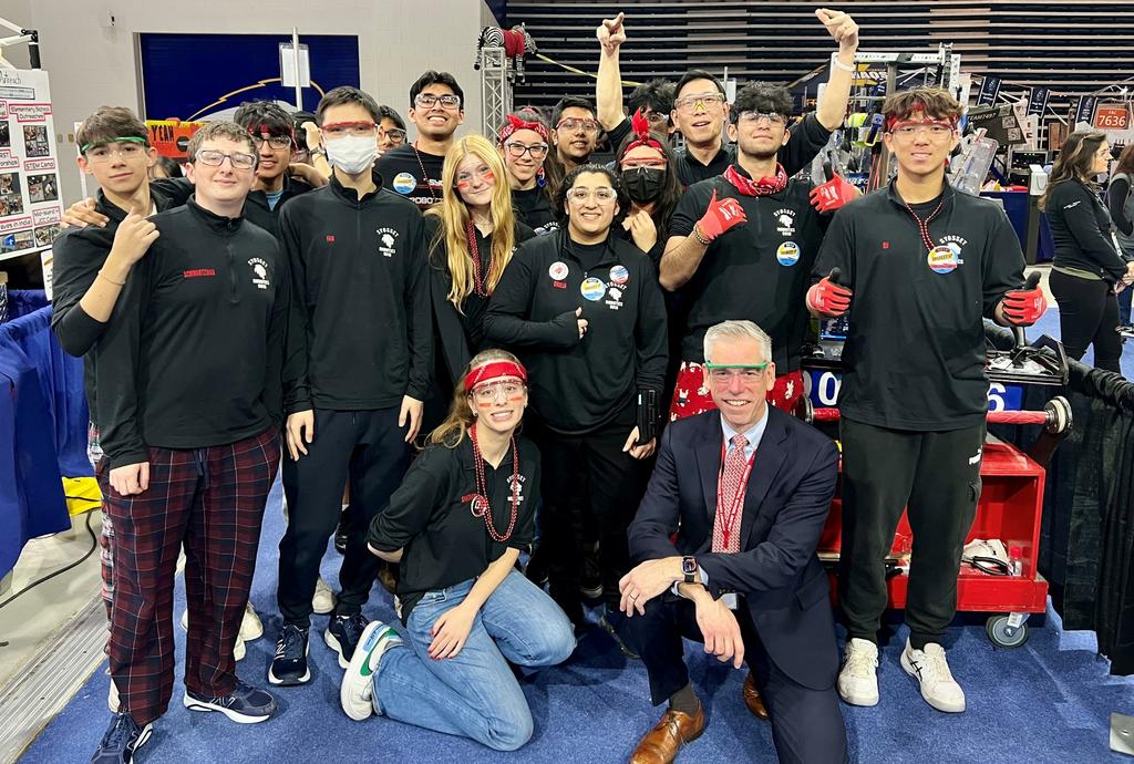 Dr. Rogers with Robotics team
