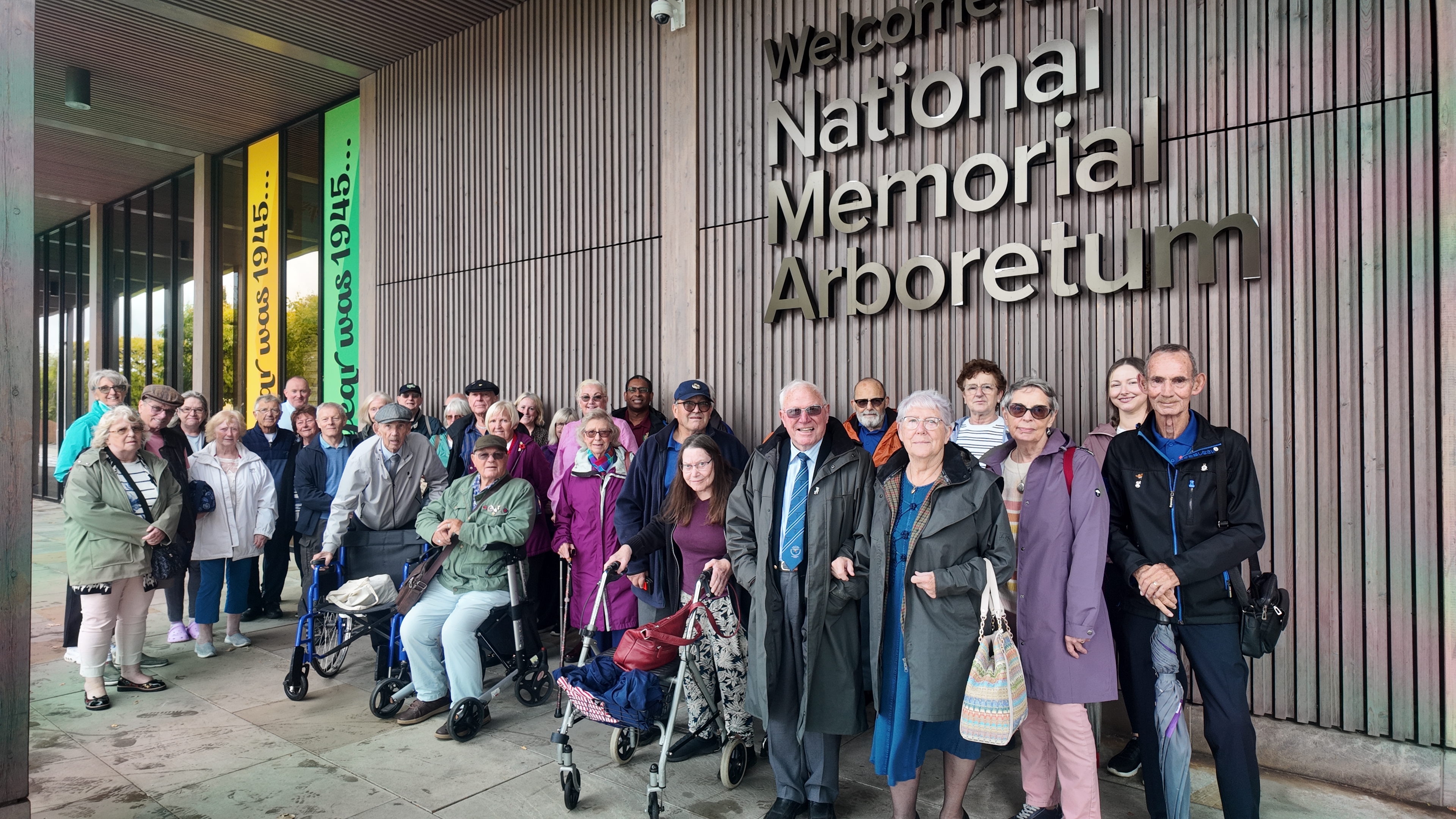 A group photo of people at the National Memorial Arboretum