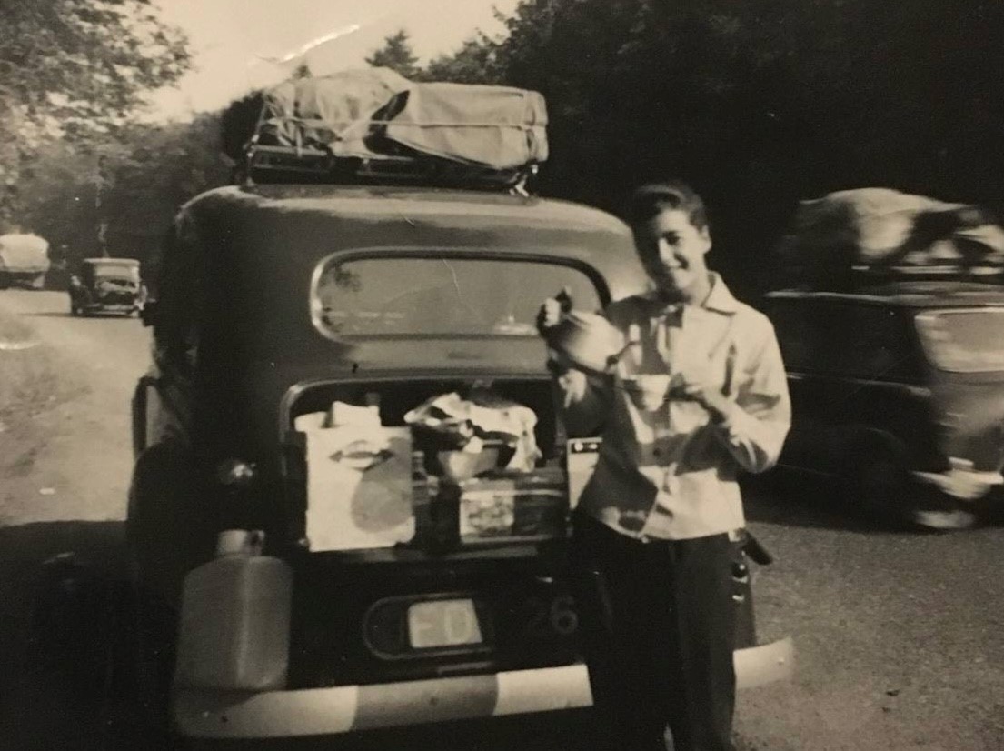 Renee's mother serving tea from the boot of the car