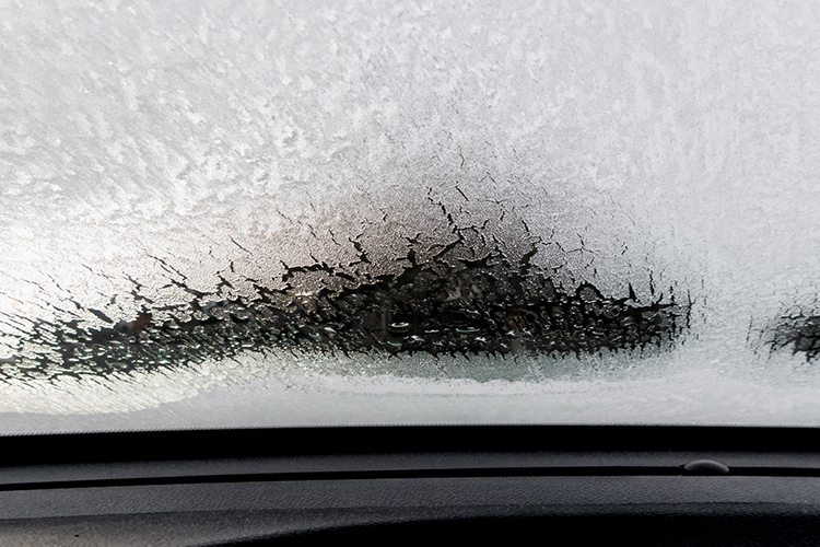 An inside view of a frozen windshield