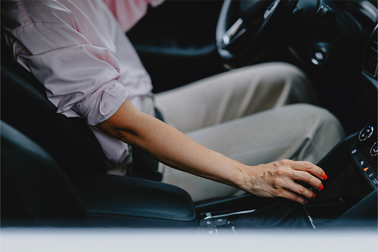 Someone adjusting the temperature of their car