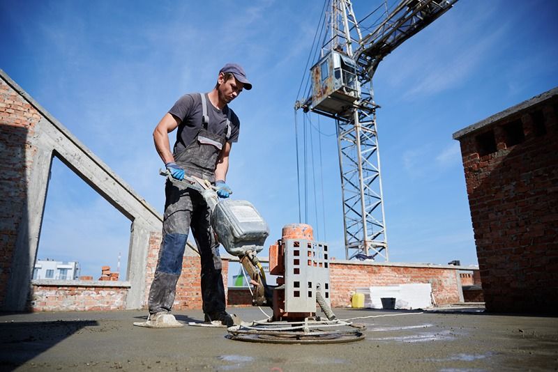 worker-leveling-fresh-floor-with-special-machine.jpg