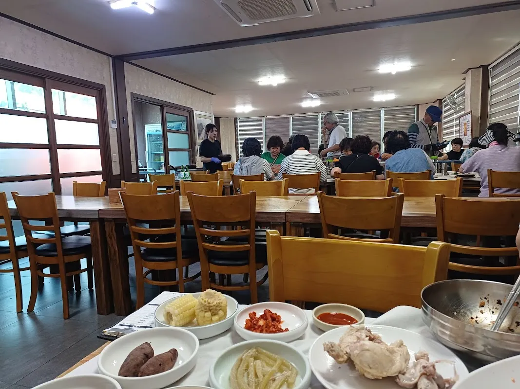 Fresh sashimi platter at Daedae Port with a view of Suncheon Bay