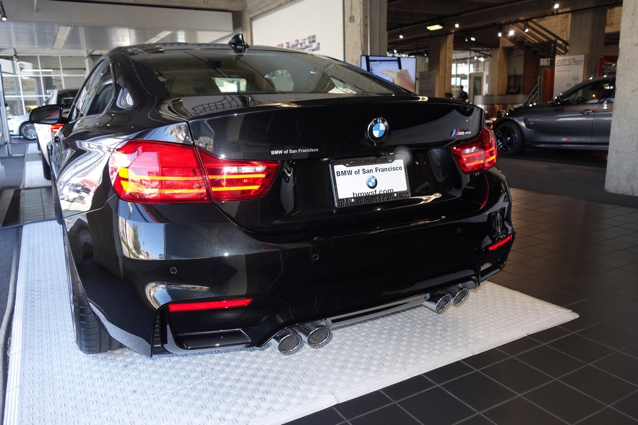 Four meaty tail-pipes stick out the rear of the M4. 