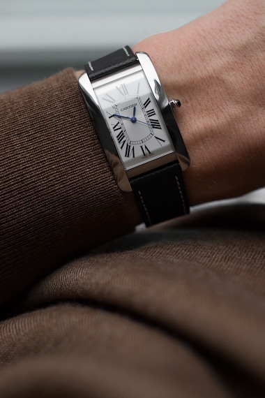 cartier tank americaine on wrist