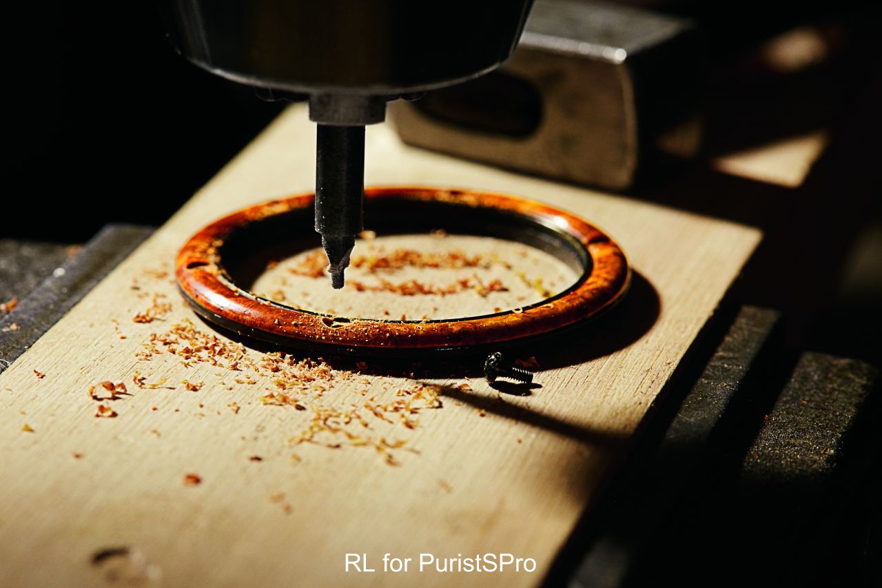 Each bezel is drilled from a solid block of Amboyna wood.